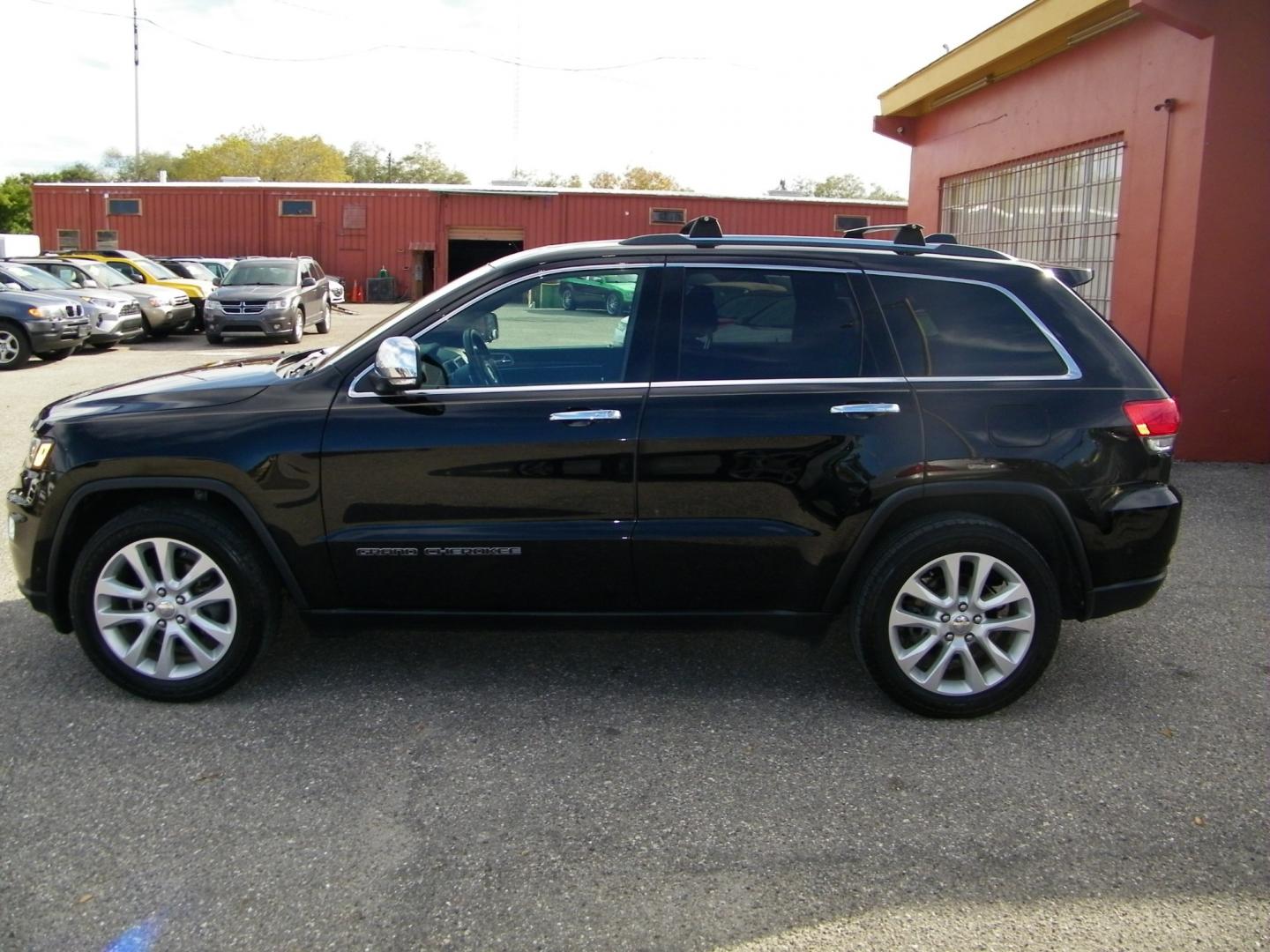 2017 Black /Black Jeep Grand Cherokee Limited (1C4RJEBG4HC) with an 3.6L V6 engine, Automatic transmission, located at 4000 Bee Ridge Road, Sarasota, FL, 34233, (941) 926-0300, 27.298664, -82.489151 - Photo#5